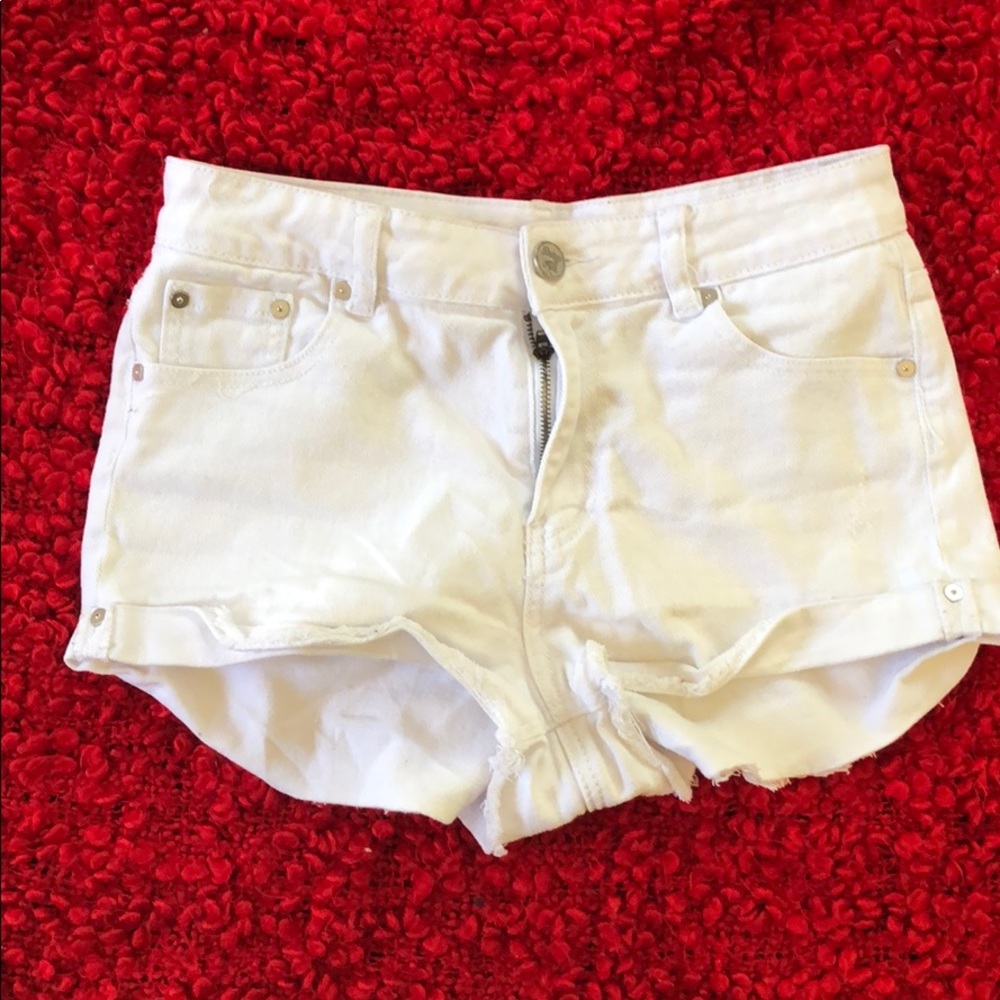 Distressed white mini shorts
